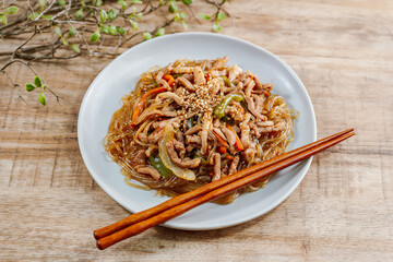 Korean style stir-fried glass noodles pork and vegetables