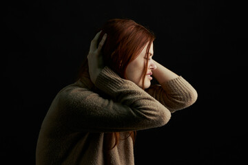 upset woman crying bruises under eyes depression dark background