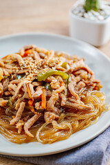 Korean style stir-fried glass noodles pork and vegetables