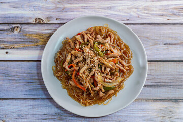 Korean style stir-fried glass noodles pork and vegetables