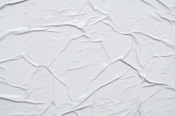 Blank white crumpled and creased paper poster texture background