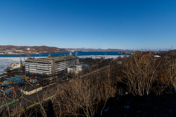 Coal transshipment port in the city of Nakhodka. Dirty coal handling facilities. Sea coal port.