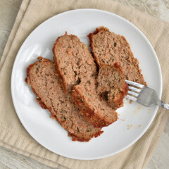 Plate of sliced meatloaf overhead view