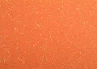 Orange textured paper background. Bright orange decorative surface.