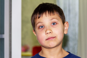 portrait of a boy with blue eyes close-up