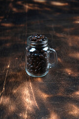 coffee in a glass cup on a dark wooden background