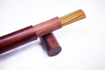 Buddhist incense sticks closeup wooden packaging