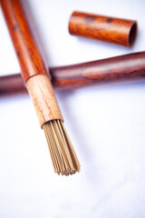 Buddhist incense sticks closeup wooden packaging