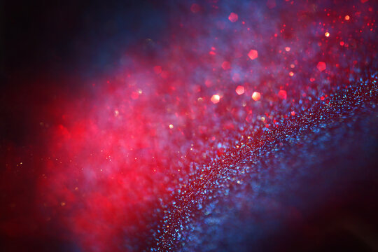 background of abstract blue, red, purple and black glitter lights. defocused © tomertu