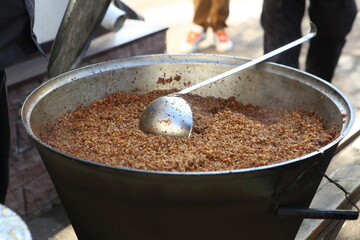 Buckwheat porridge in a cauldron on the street