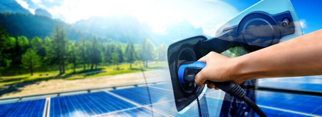 EV charging station for electric car in concept of green sustainable energy produced from renewable...