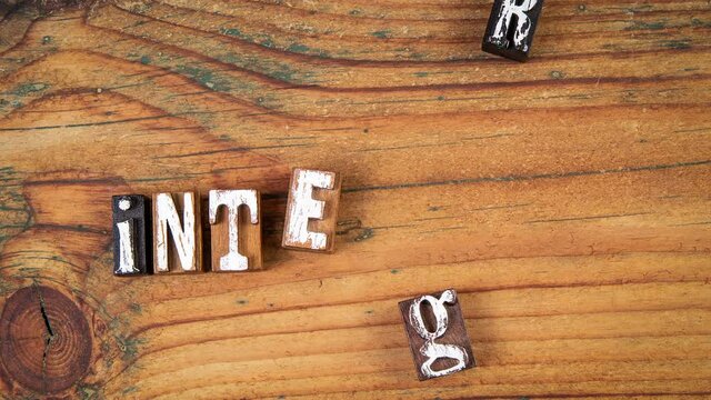 Integrity. Moving wooden letters on a wooden background
