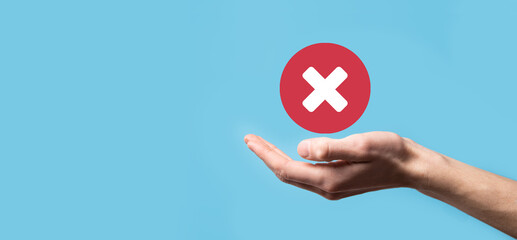 Hand holds icon,cancellation symbol,cancel icon.Cross mark flat red icon.round X mark.cancel...