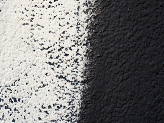 Black and white texture of a plastered wall