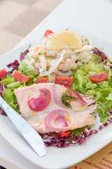 Seafood salad with salmon and vegetables