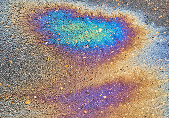 abstract colorful textured background, gasoline divorce on wet asphalt, chromatic fuel stain on...