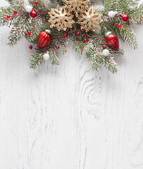 Christmas border with fir branches and  baubles on white shabby wooden board with copy space for text. Flat lay.  Christmas and New Year holidays background. - 466111755