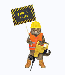 A beige cat in a construction helmet holds a jackhammer and a poster that says safety first. White background. Isolated.