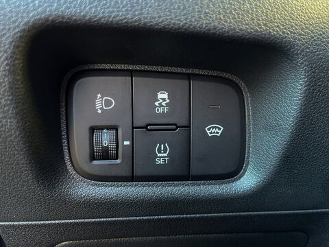 Seoul, South Korea - 10.29.2021: Interior of a Hyundai Creta 2021 or Hyundai ix25 car. Buttons for adjusting the height of the headlights, turning off the ESP, turning on the windshield heating