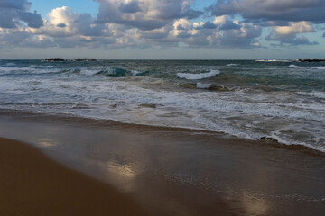Cumulus clouds over the rough sea