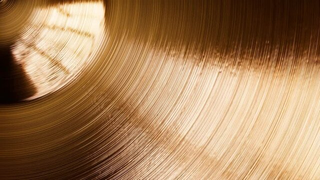 Shiny hand made drum plate. Closeup of cymbal for drums in the recording studio.