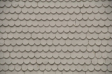 Grey house wall pattern with rounded plates
