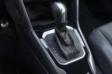 Automatic Transmission Stick and Elegant Car Interior with black and silver elements