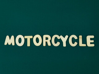 Wooden Motorcycle Word With Green Background