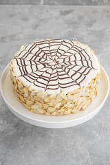 Traditional Esterhazy cake with almonds and pralines on a gray concrete background. Selective focus. Copy space.