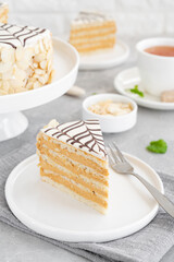 Traditional Esterhazy cake with almonds and pralines on a gray concrete background. Selective focus. Copy space.