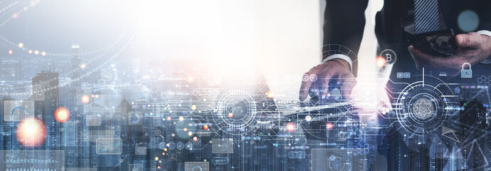 Double exposure of businessman using laptop computer and the city with global networking, data exchanges, innovative futuristicd technology icons, modern tech icons, Global business