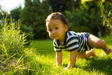 child playing in the grass