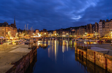 Obraz premium Blue hour scene at historical port of Honfleur, a french commune in the Calvados