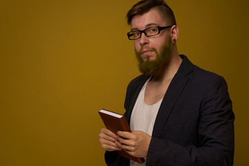 business man with glasses notepad in the hands of a studio official
