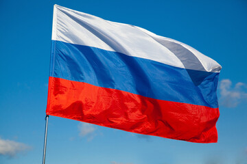 Tricolor flag of Russia waving in the wind close