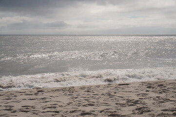 Naklejka na ściany i meble Blue Sky Clouds Gently Breaking Surf on the Beach