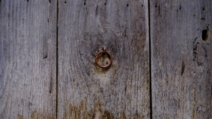 antique iron ring on old wooden door