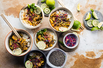 Delicious traditional asian curry in bowls.