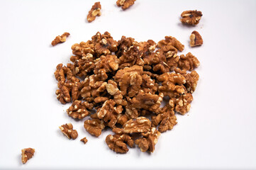 Peeled walnut on white background. Handful of nuts