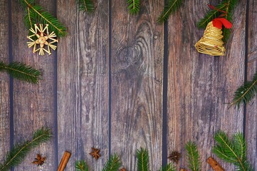 Christmas background with decorations on a brown wooden background. Flat lay, top view with copy space.