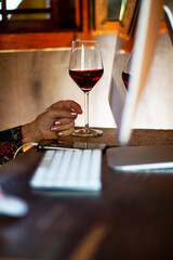 Working from home.
Senior woman working from home, using computer, in a rustic house.