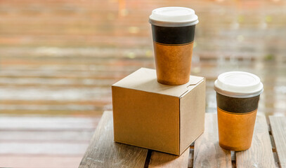 coffee in cardboard brown cups ordered and delivered for takeaway, food delivery, takeout, copy...