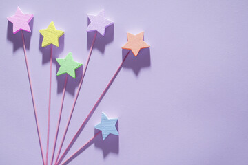 Beautiful background with bright stars and copy space. Cute birthday card with colorful stars.