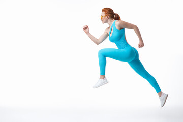 Fototapeta na wymiar Young sportswoman leaping during training