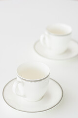 white porcelain tea cup on natural background.