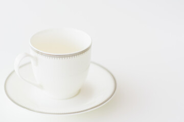 white porcelain tea cup on natural background.
