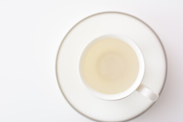 white porcelain tea cup on natural background.