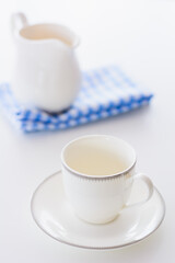 white porcelain tea set on natural background.