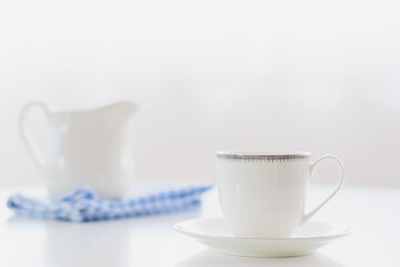 white porcelain tea set on natural background.