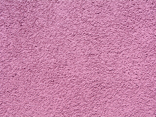 Pink plastered wall with copyspace